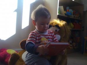 Reading a book with Mr Lion Chair